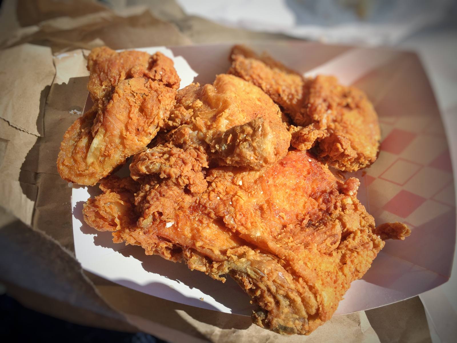 A to-go tray. General admission starts at $21, the festival is cashless, and kids 12 and under get in free with a ticketed adult.