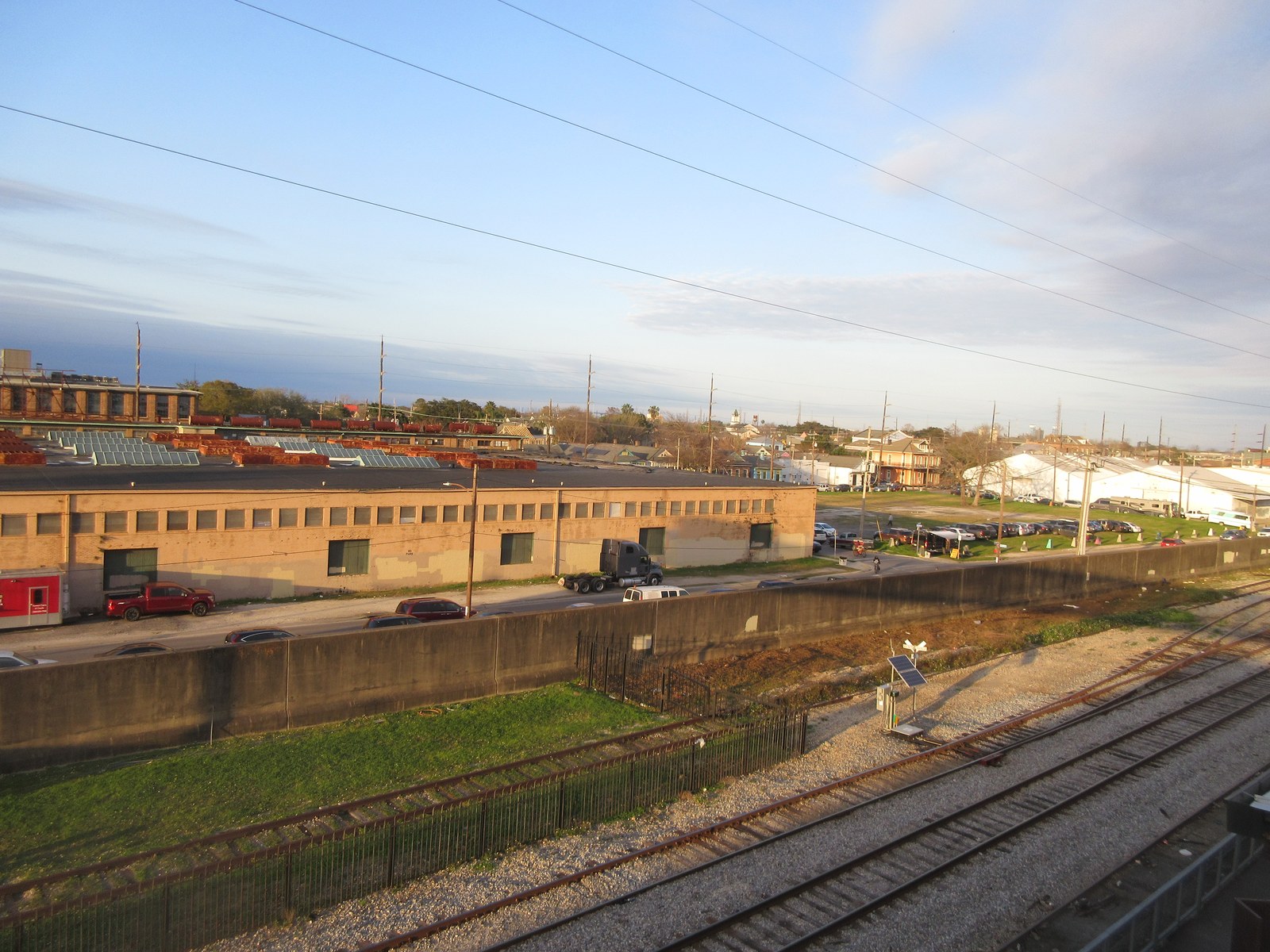The riverfront between the Quarter and Bywater was fenced industrial land for decades. The new park project stitches it into a continuous public route.