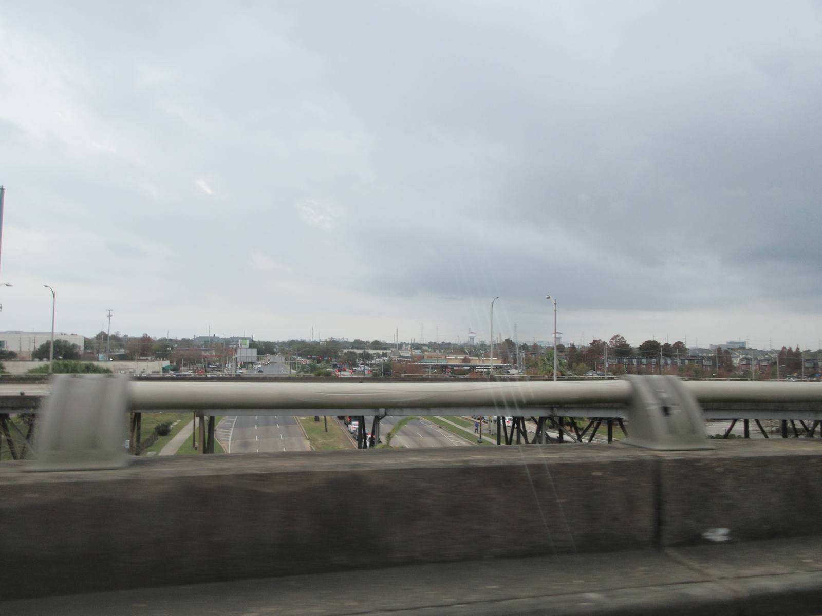 A view over the guardrail of the elevated Interstate 10 in New Orleans. Daniels went over the side after the second collision; friends searched for her by flashlight.