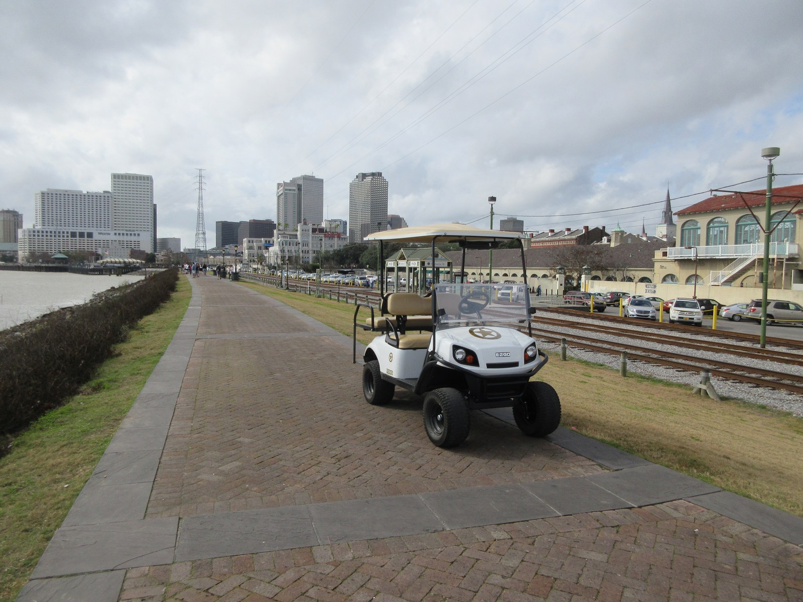 An NOPD patrol cart on the riverfront path. The department entered federal oversight in 2013 and left it in 2025.