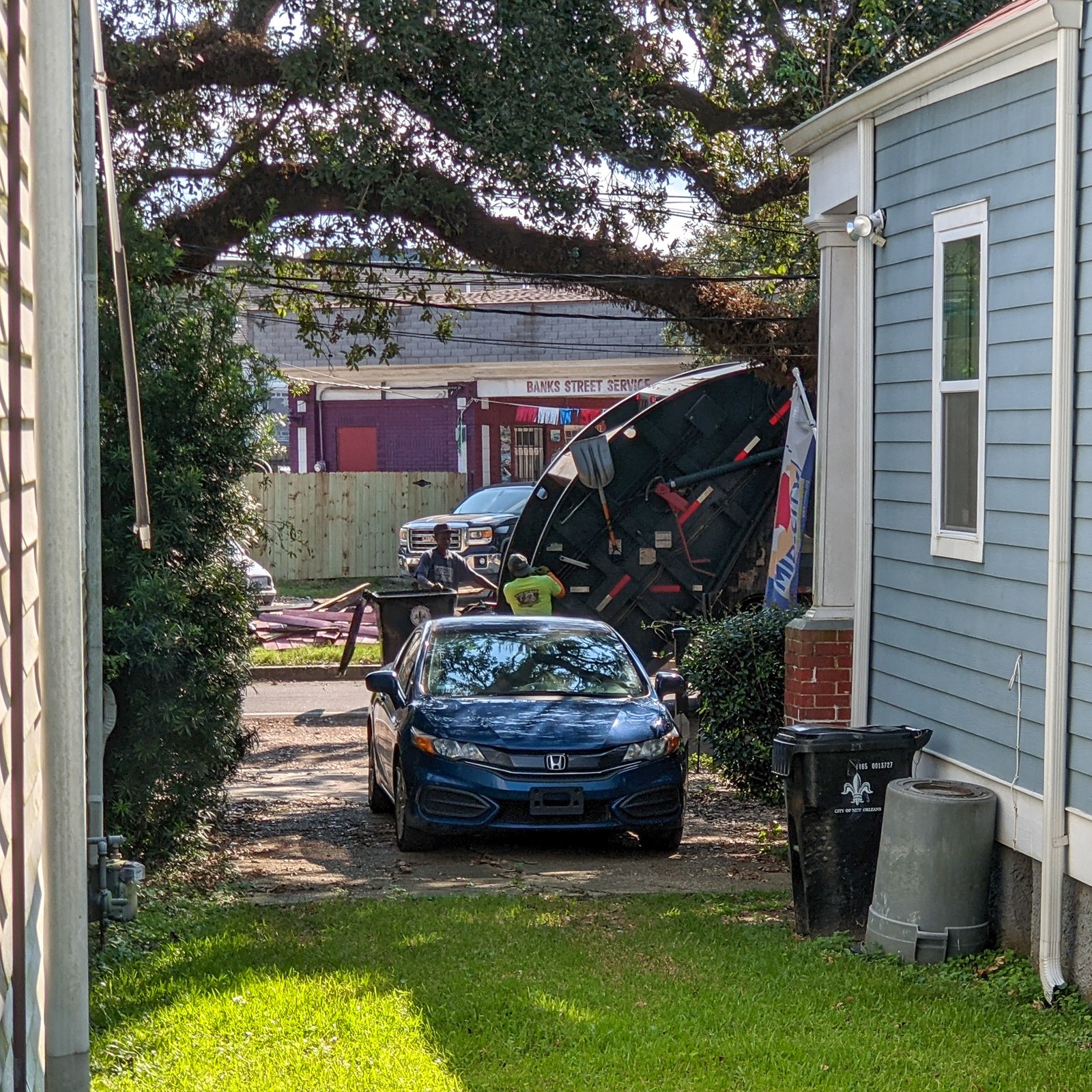 Debris pickup in Mid-City after Hurricane Ida. The administration identified 12,915 questionable addresses on the sanitation billing rolls.